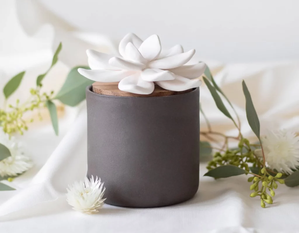 a ceramic lotus flower shaped essential oil diffuser makes a great eco-friendly gift for crunchy or minimalist people